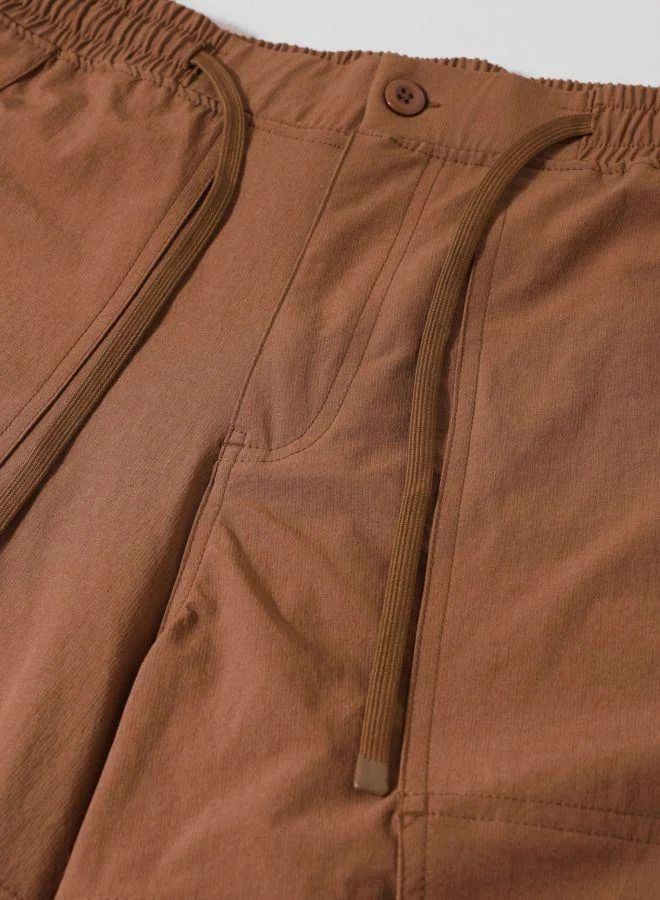 The Indian Garage Co  Men Baggy Fit Solid Cross Pocket Mid-Rise Trousers for Men | Best Price UAE
